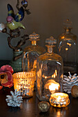 Lit candles with vintage bottles in King's Lynn  Norfolk  England  UK