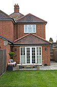 Lawned exterior of brick Surrey home   England   UK