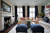 Pair of blue ottoman footstools with co-ordinating with curtains London townhouse   England   UK