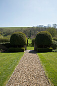 Symmetrical box hedges with gravel path in grounds of Warminster country house  Wiltshire  England  UK