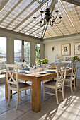 Sunlit conservatory dining room in Warminster country house  Wiltshire  England  UK