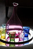 Assorted drinking glasses and blow vase on silver tray in contemporary London home, England, UK