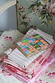 Stamp collection on folded fabrics in Norfolk home England UK