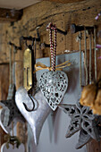Assorted metal hearts hang in Wokingham cottage Berkshire UK
