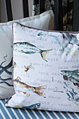 Cushions with fish motifs in Wokingham cottage Berkshire UK