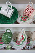 Chinaware and cups on kitchen dresser in Dorset home England UK