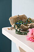Jewellery in seashell on mantlepiece in Berkshire home England UK
