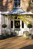 Porchway at front door of detached Sussex home England UK