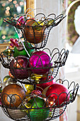 Assorted metallic baubles in wire stand Sussex England UK