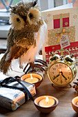 Alarm clock and tealights with owl at Christmas in Kent home England UK