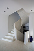 Twisting marble staircase with blue vase in Ithaca villa Greece