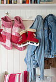 Denim jackets and ice skates with Christmas stockings in South London family home England UK