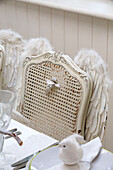 Dining chair decorated with angel wings in London home England UK