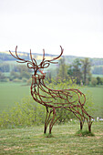 Metal sculpture of a deer with antlers in grounds of Kelso home Scotland UK