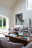 Large artworks in living room conversion of Gloucestershire farmhouse England UK