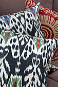 Black patterned fabric on cushions in Gloucestershire farmhouse England UK