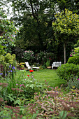 recliner on lawn in back garden of London townhouse UK