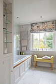 Roman blinds at window of bathroom with niche shelving in Georgian rectory Northamptonshire England UK