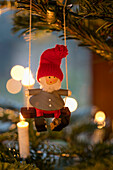 Gnome on rope swing Christmas tree decoration in Berkshire home UK