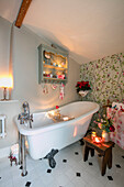 Slipper bath in light green bathroom of Georgian cottage Liverpool UK