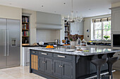 Large marble topped kitchen island in detached Sussex country house UK