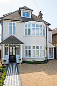 Tiled porch entrance and path to three-storey Edwardian house Surrey UK