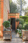 Container post and front door to converted brick South London schoolhouse UK