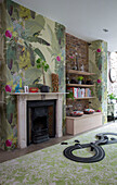 Car track and shelves with tropical wallpaper in Victorian London townhouse UK