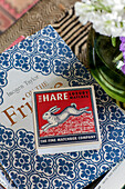 Matchbox and book with decorative cover in Somerset farmhouse UK
