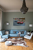 Light blue corner sofa with seashell pendant light in detached Kent home UK