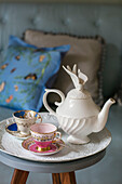 Teapot with cups and saucers on tray in detached Kent home UK