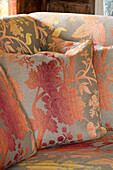 Embroidered cushions on sofa in West Sussex home UK