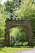 Old stone gateway in Northamptonshire woodland UK
