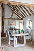 Table for eight with beamed ceiling in Hampshire home UK