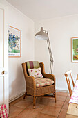 Wicker chair with large anglepoise in Kent home UK