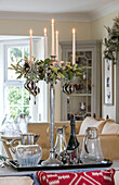 Tall silver candelabra with antique decanters in Herefordshire newbuild UK