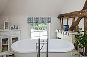 Freestanding bath and cabinets in timber framed Kent cottage UK