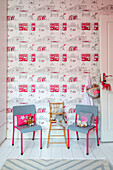 Grey chairs and patterned wallpaper in child's room London home UK
