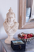Bust of Queen Victoria and bowl of apples with casket on sideboard in Cornwall UK