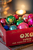 Christmas baubles on vintage storage tin Norwich UK