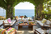 Low wooden table in outdoor living room of Italian villa on the Amalfi coast