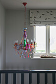 Glass chandelier in grey staircase of Hampshire home England UK