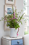 Foxgloves and wildflowers in 1950s style jug West Sussex UK