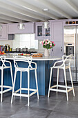 Bar stools in blue and lilac kictehn with slate floor tiles Surrey UK