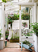 View through doorway to single bed in conservatory of Isle of Wight, UK
