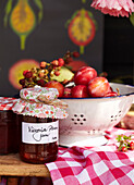 Victoria Plum Jam beside colander with plums and berries