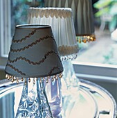 Three glass table lamps with decorative lampshades and beading