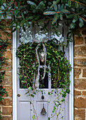 Festive front door with wreath, Oxfordshire, UK