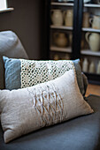 Homemade cushions with lace and pleated linen