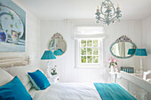 Bedroom in white with turquoise colour accents